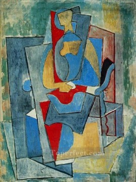Femme assise dans un fauteuil rouge 1932 Cubismo Pinturas al óleo
